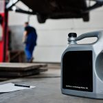 A bottle of oil in a car workshop