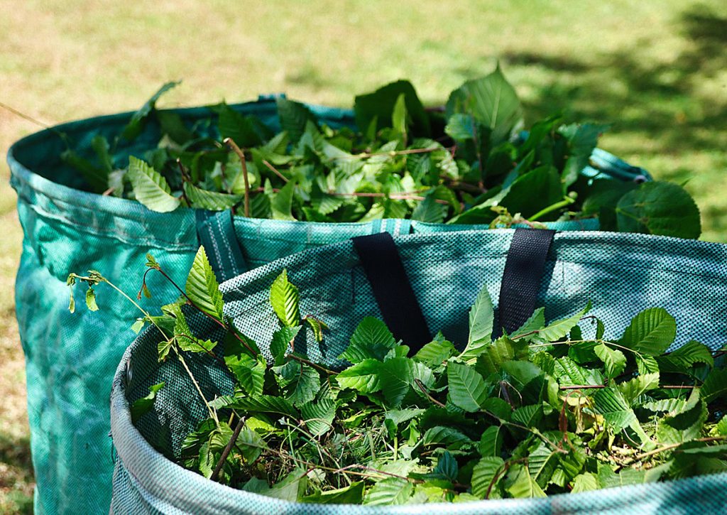 Two baskets containing green waste