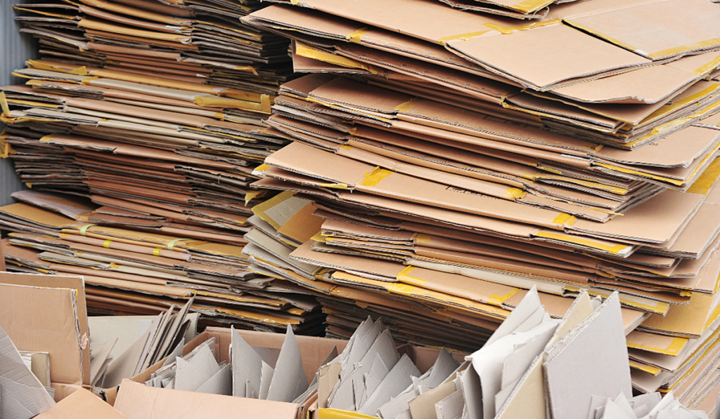 A pile of flattened cardboard boxes