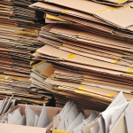 A pile of flattened cardboard boxes