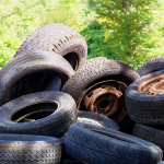 A mound of used tyres outside