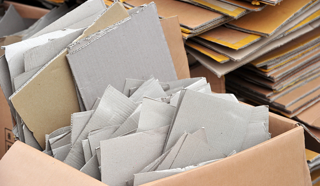 A pile of used cardboard stacked together