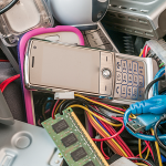 Electronic devices ready for e-waste recycling in Adelaide, including mobile phones, cables and computer components