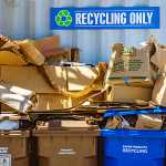 Cardboard and paper waste in recycling bins
