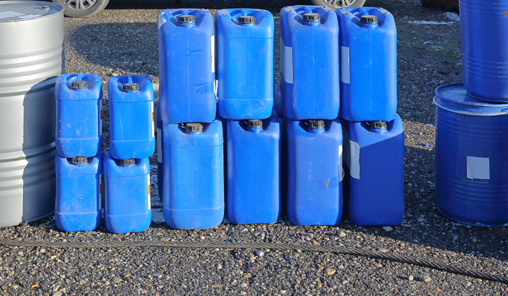 Blue containers and drums for liquid waste storage