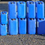 Blue containers and drums for liquid waste storage