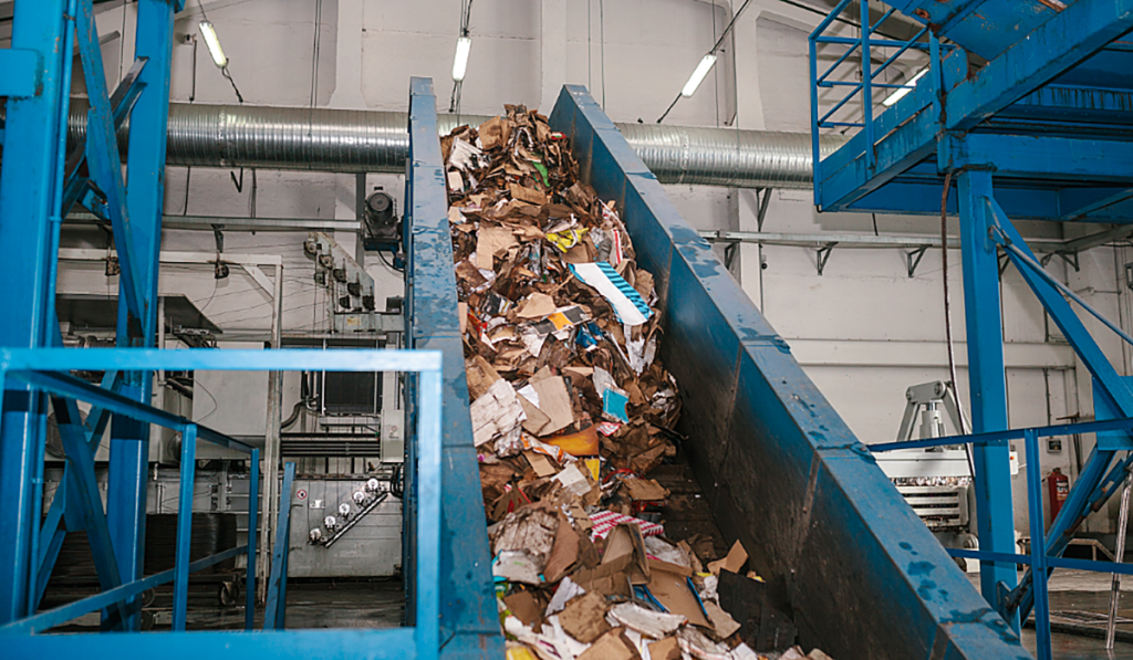 Recycling in Adelaide at a resource recovery facility sorting recyclable materials on a conveyor belt